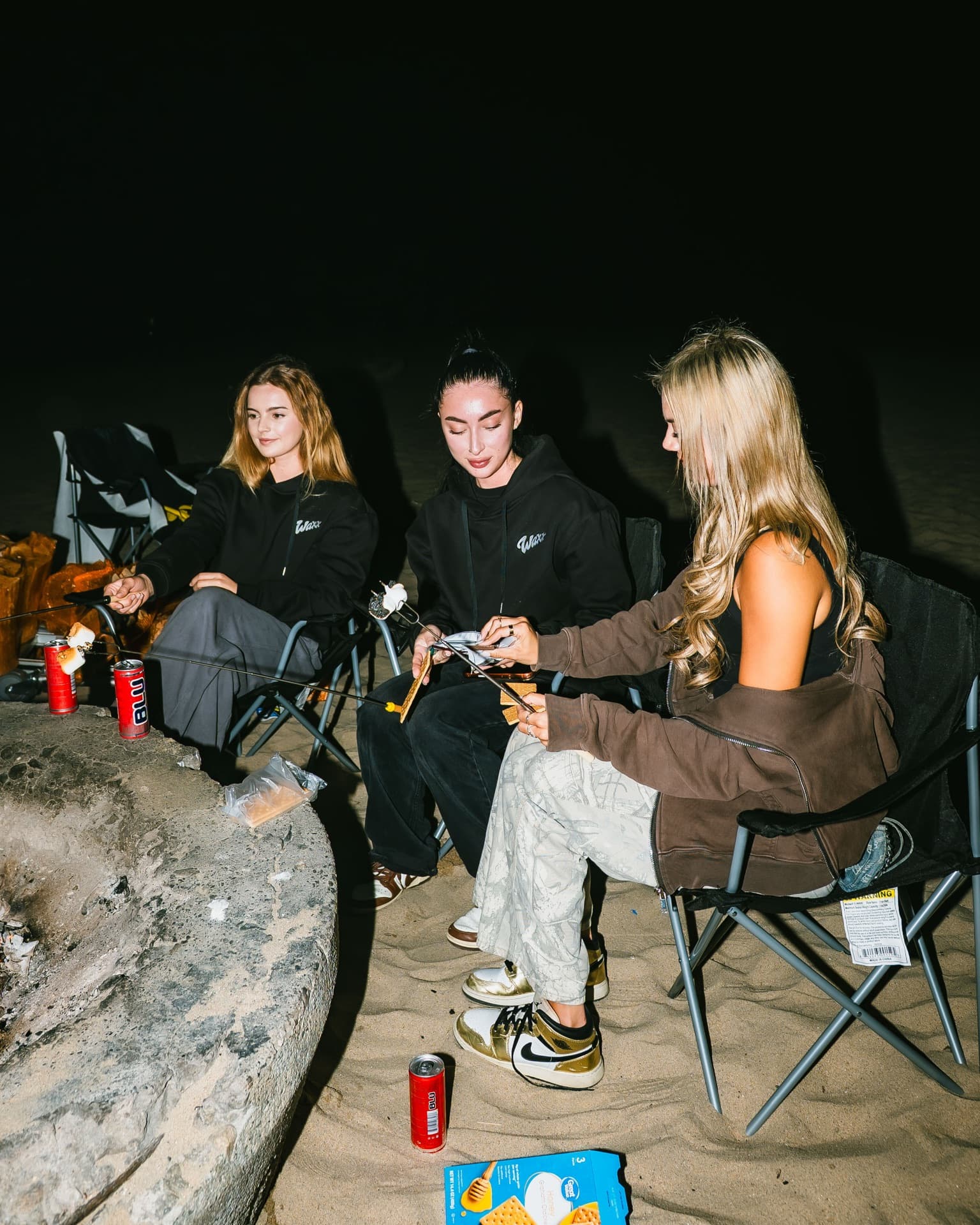 Waxx Brandz team around the bonfire in Los Angeles